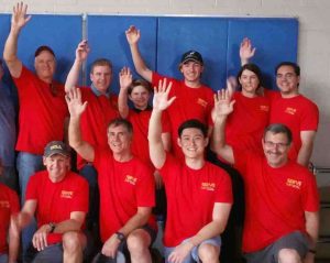 bridges leaders with hands raised